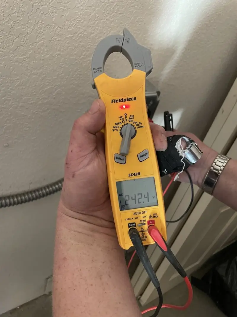 Voltage testing with clamp meter during Ceiling Fan Installation in Luray